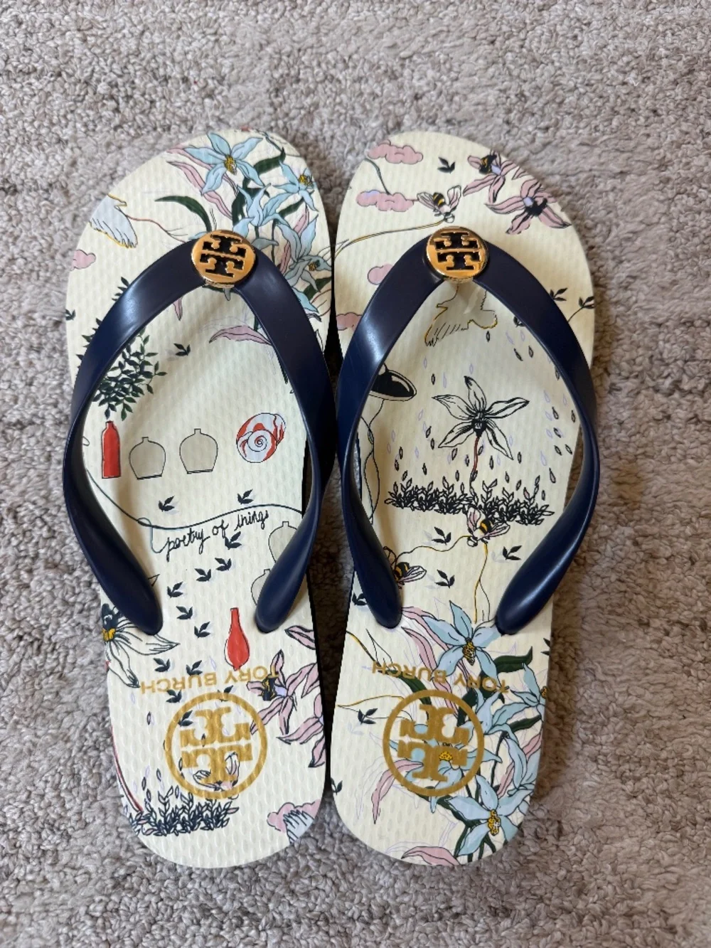 Tory Burch navy “poetry of things” flip flops, size 7 1/2
